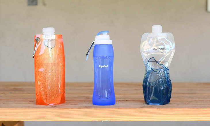 collapsible water bottles on a table