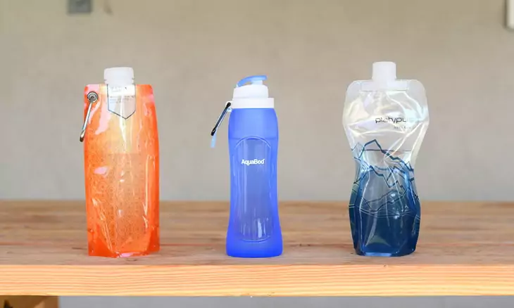 collapsible water bottles on a table