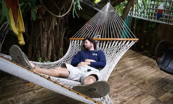 A man relaxing in a hammock