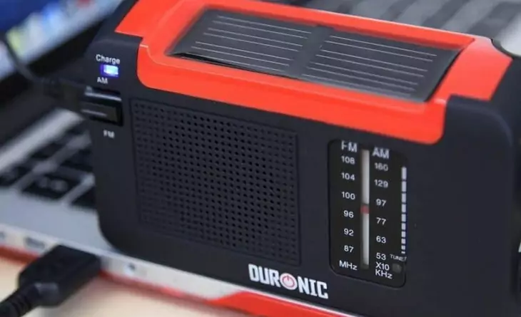 Duronic Hybrid solar charged radio sitting on a laptop