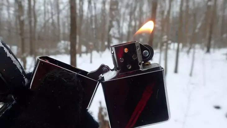 Flame of a windproof lighter in the winter time