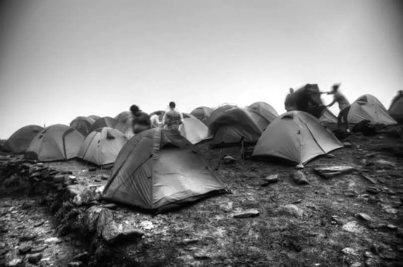 Setting up tents in rainy conditions