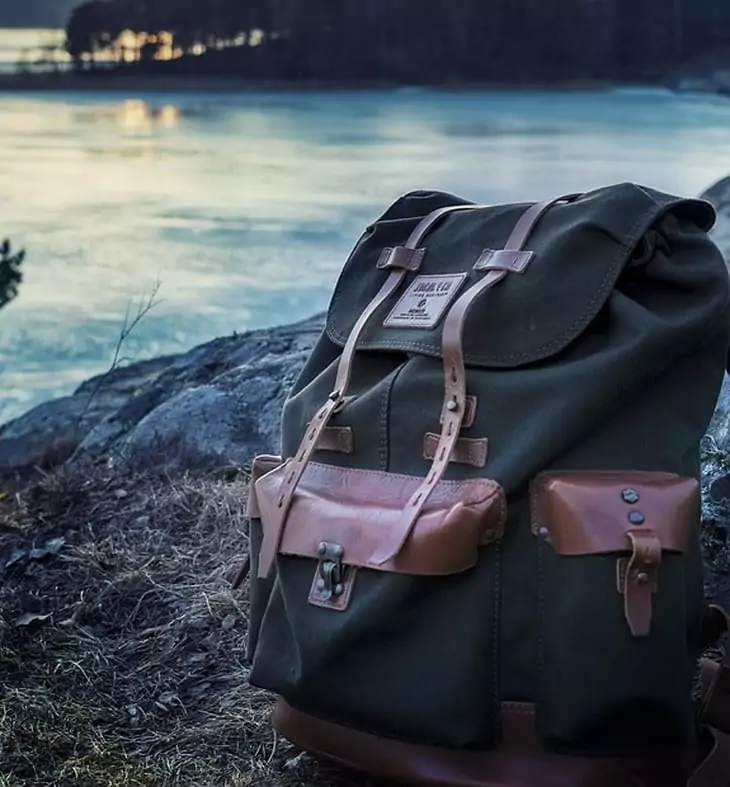 a daypack standing near a river