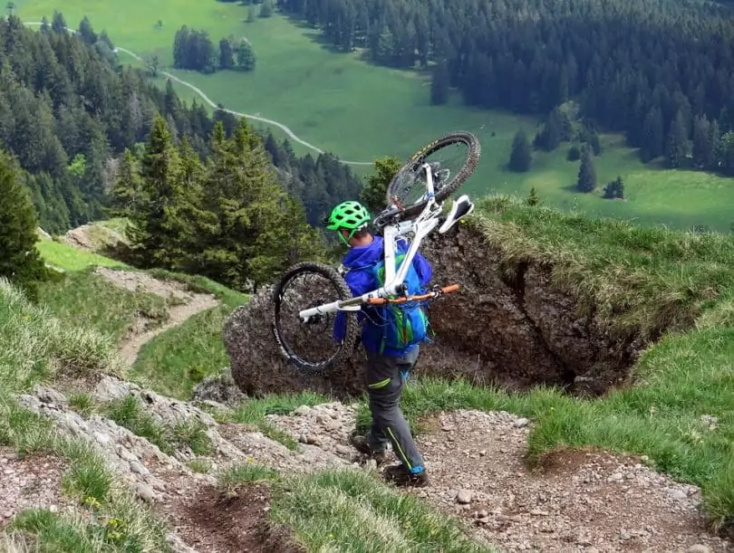 a mountain hiker with his bike