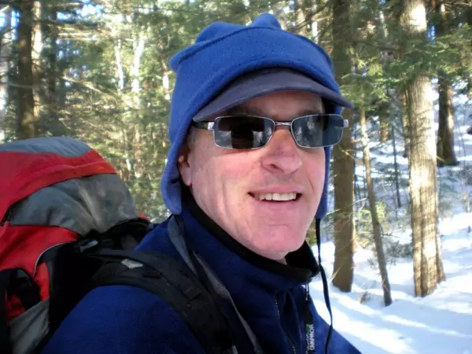 man-winter-hiking-wearing-a-hat-