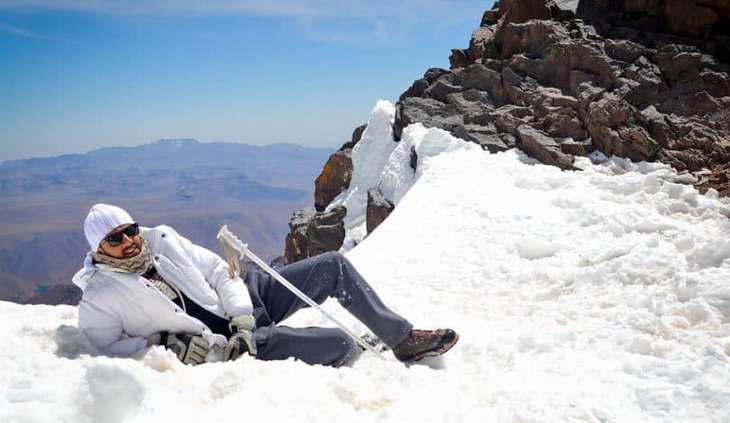 men-getting-rest-in-the-top-of-the-mountain