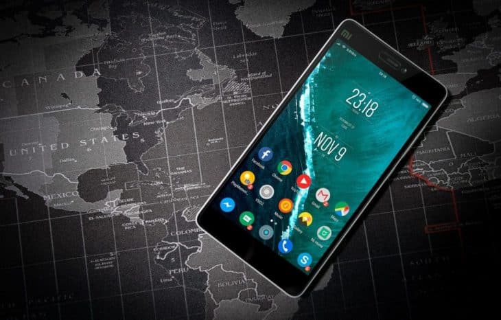 a photo of a mobile phone sitting on a map