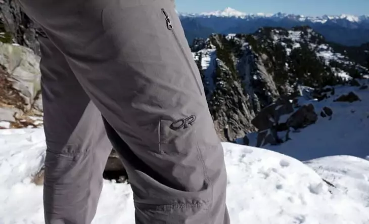 A man wearing a windproof hiking pants