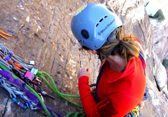 picture of a woman climbing the mountain