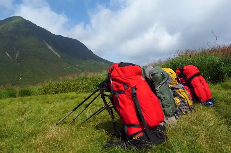 picture of backpacks and the mountains in the background