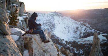 picture of a man climbing the mountains