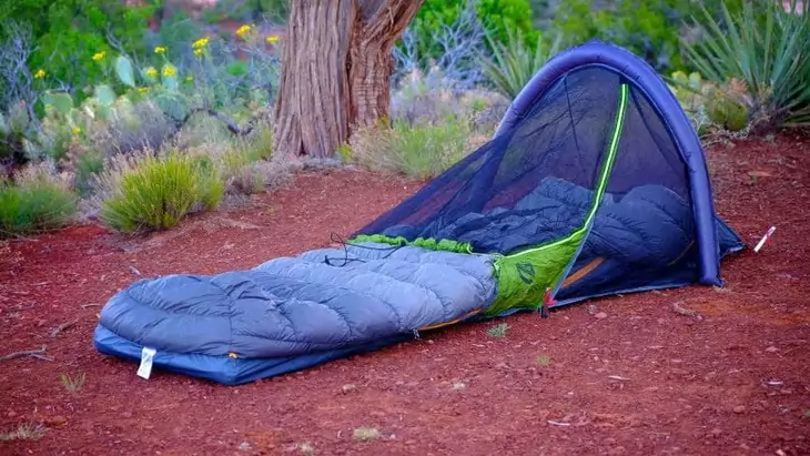 A bivy sack on a red ground