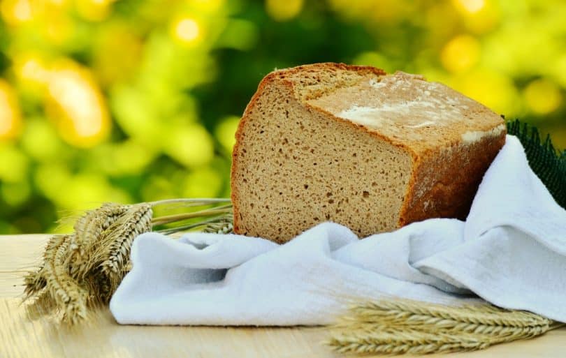 Brown Loft Bread in White Textile on Beige Table