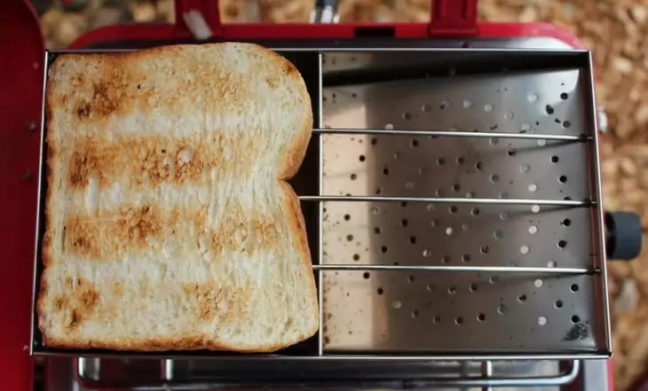 Frying a bslice of bread on a camp toaster