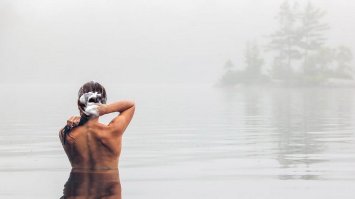 A woman bathing in a lake