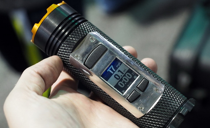 A man holding a flashlight gadget