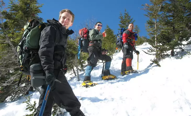 Hikers climbing the moutain in the winter time