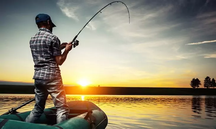 A man fishing in the lake