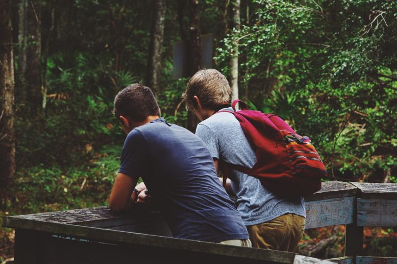 two adults backpacking in the nature