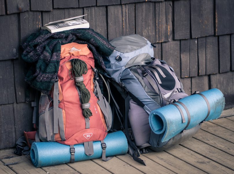 picture of two backpacks on the ground