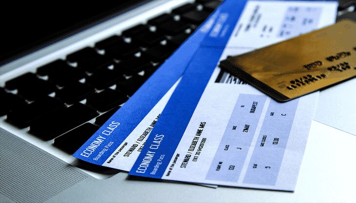 Economy class tickets on a laptop