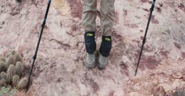 A woman wearing hiking gaiters