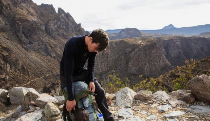 Man checking his backpack