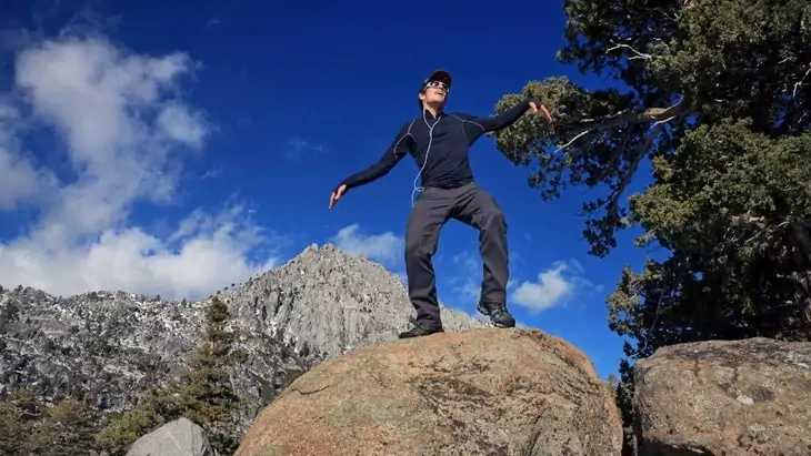 A man dancing while wearing a base layer