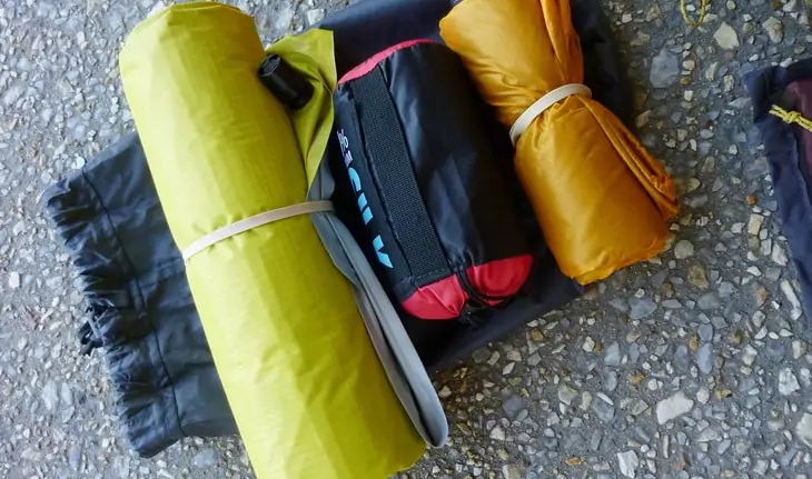 backpacking gear on the ground