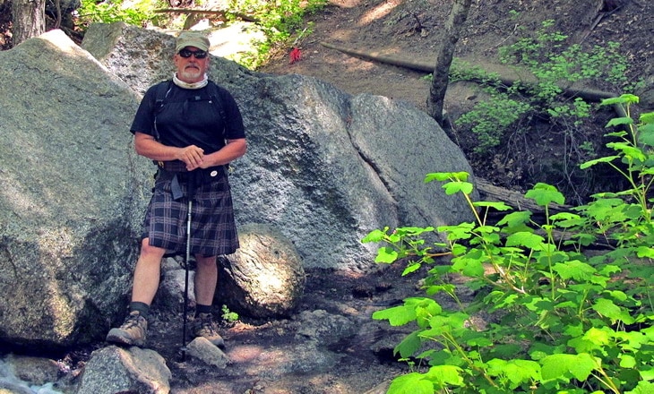 Hiker with kilt taking a picture