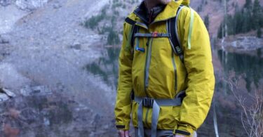 A man wearing versatile jackets for hiking and everyday use to ultralight emergency shells