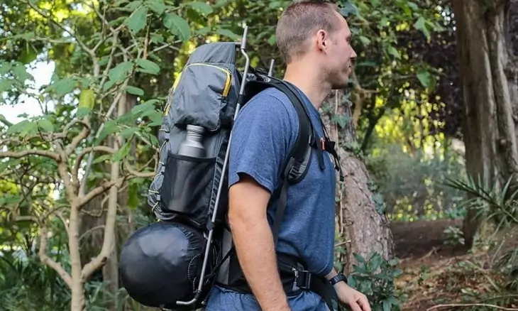 A man with an external-frame-backpack-768x512
