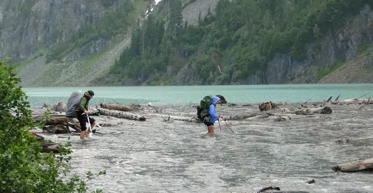 Fording the outlet of Blanca Lake, headwater North Fork Skykomish River.