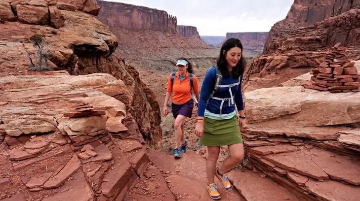 Two girls hiking in skirts