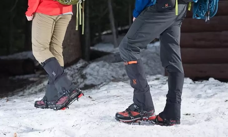 Two adults wearing gaiters on a winter time