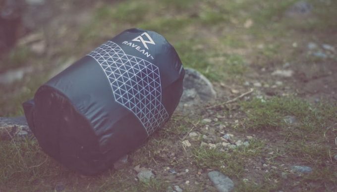 Image showing a sleeping bag in a sack on the ground