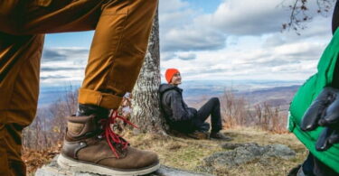 Image showing a man wearing a pair of stylish-hiking-boots and his friend next to him