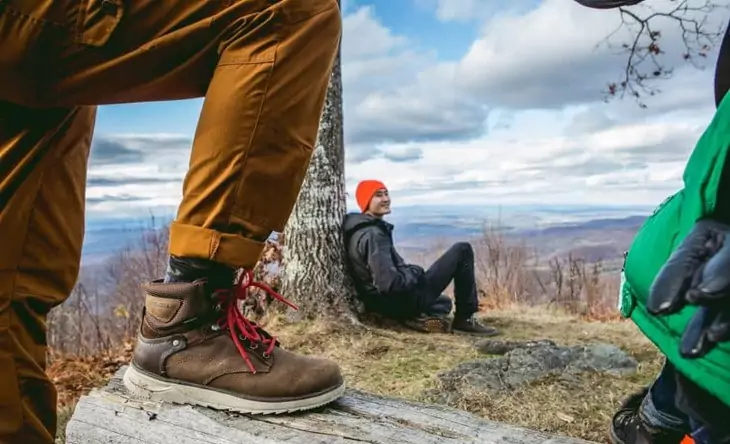 Image showing a man wearing a pair of stylish-hiking-boots and his friend next to him