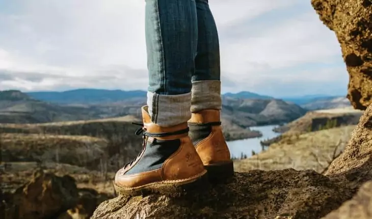 A woman wearing a pair of -hiking-boots