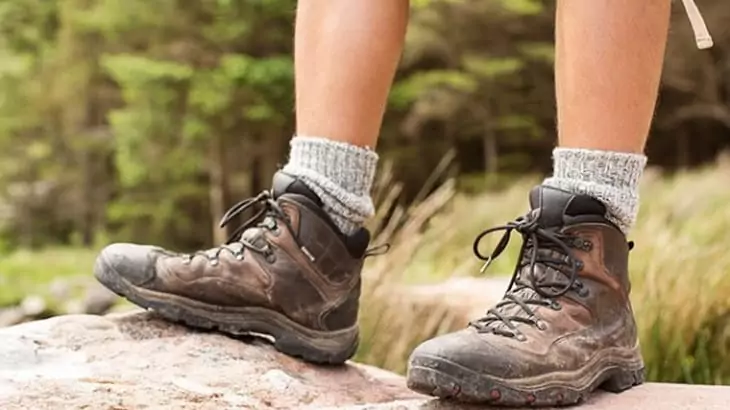 A man wearing regular hiking boots