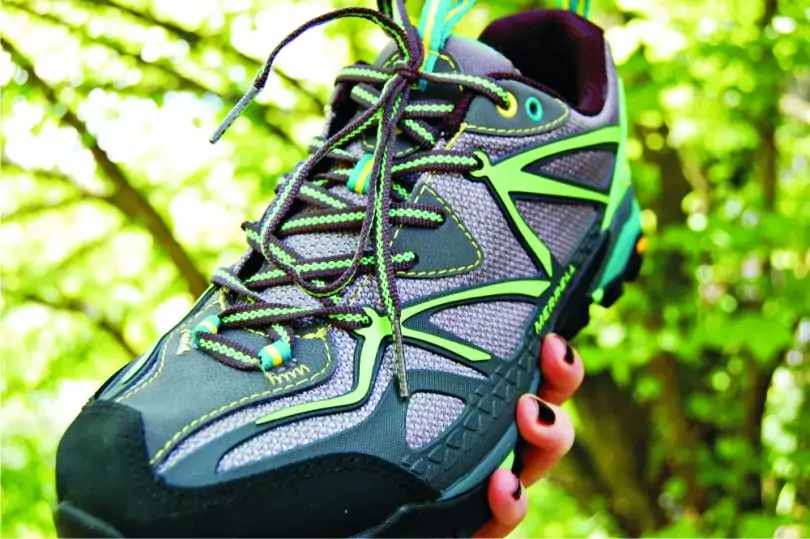 girl-holding-hiking-shoes