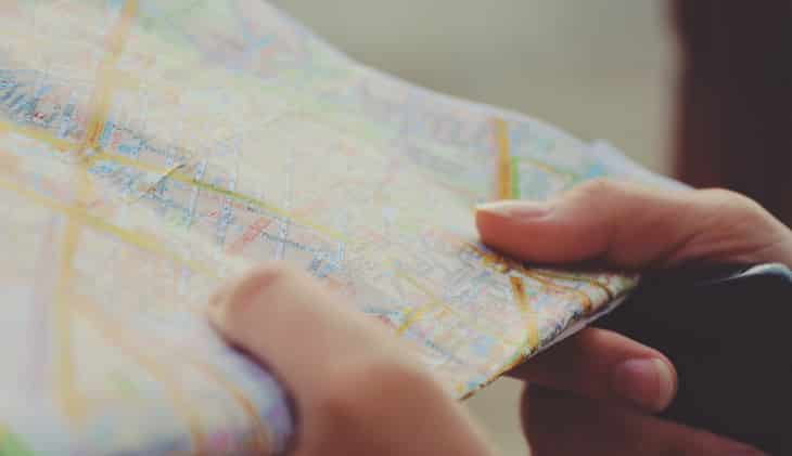 Woman holding a map in her hands