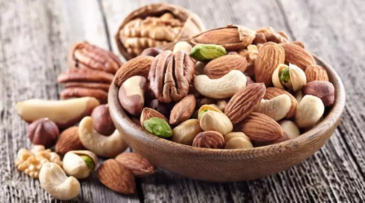 Nuts mix in a wooden plate