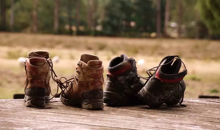 hiking boots on the ground outside