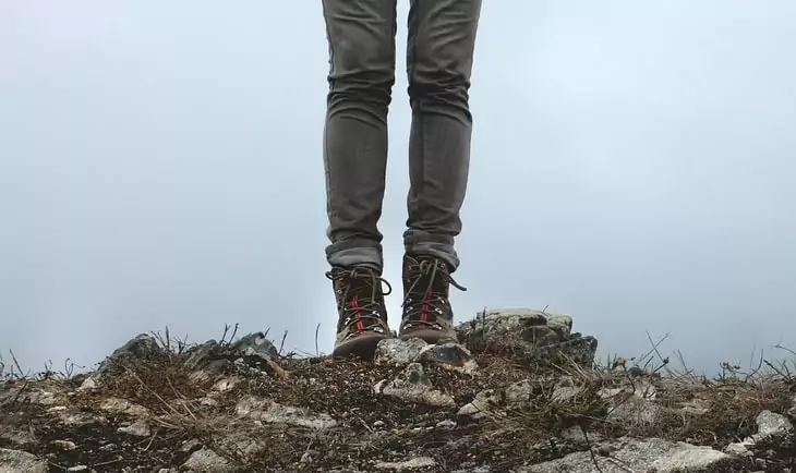 A woman hiking in skinny jeans