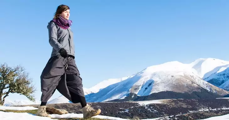 A woman walking while wearing a pair of hiking skirts