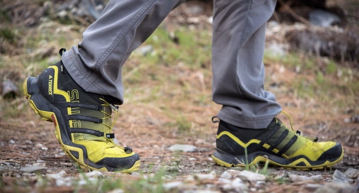 A man hiking in lightweight Terrex Swift