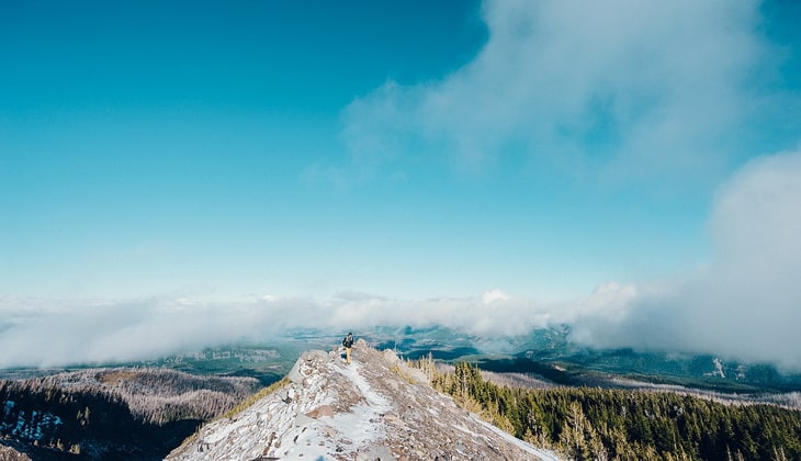 Man on top of the mountain