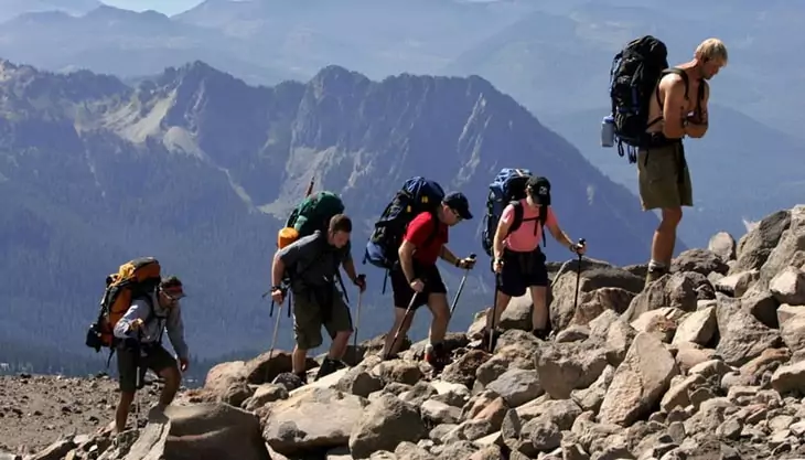 backpackers climbing the mountain
