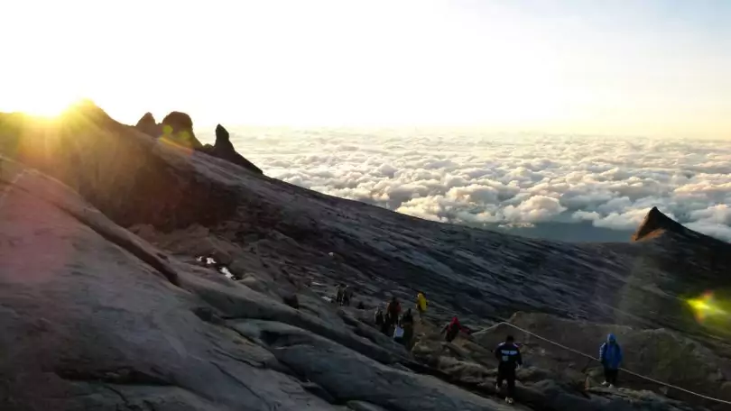 group of people on the top of the mountains